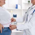 Person checking blood sugar levels while on a medical weight loss for diabetes program