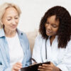 Woman discussing HRT for women with healthcare provider