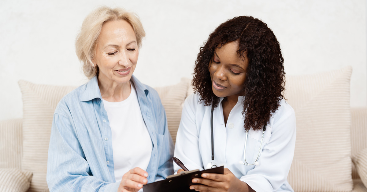 Woman discussing HRT for women with healthcare provider