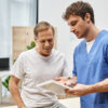 Man discussing TRT for men during testosterone therapy consultation