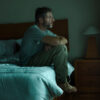 Man experiencing symptoms of low testosterone in men including persistent fatigue and low energy