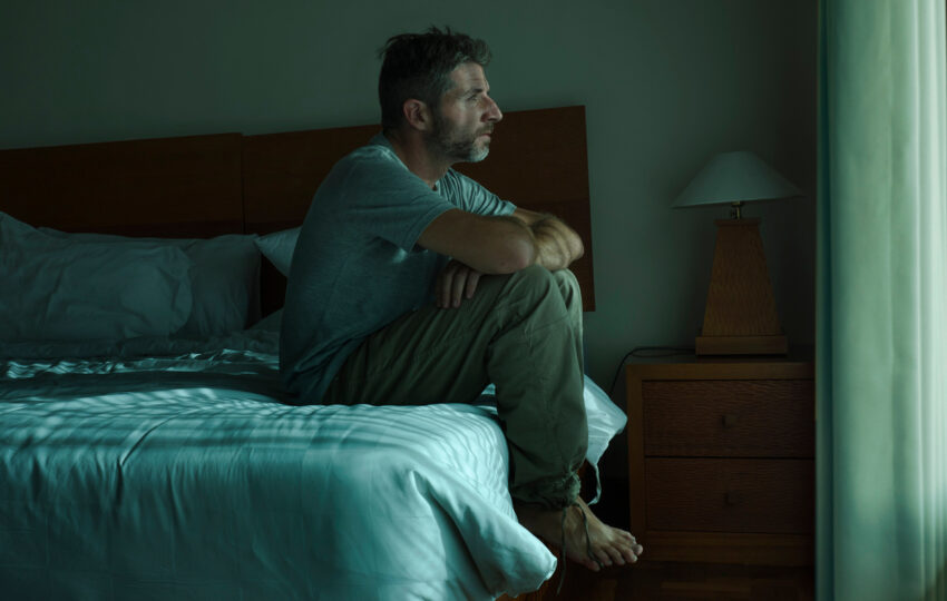 Man experiencing symptoms of low testosterone in men including persistent fatigue and low energy