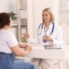 Healthcare provider explaining a medical weight loss consultation to a female patient in a modern clinic
