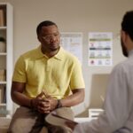 Male patient discussing forms of TRT for men with a healthcare provider during a clinical consultation