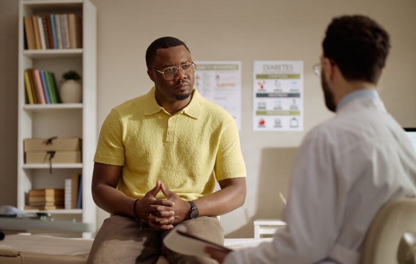 Male patient discussing forms of TRT for men with a healthcare provider during a clinical consultation