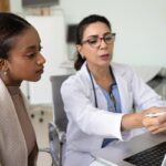 Healthcare provider reviewing keeping weight off after GLP-1 progress with a patient on a laptop