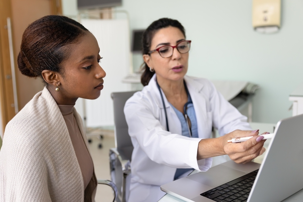 Healthcare provider reviewing keeping weight off after GLP-1 progress with a patient on a laptop