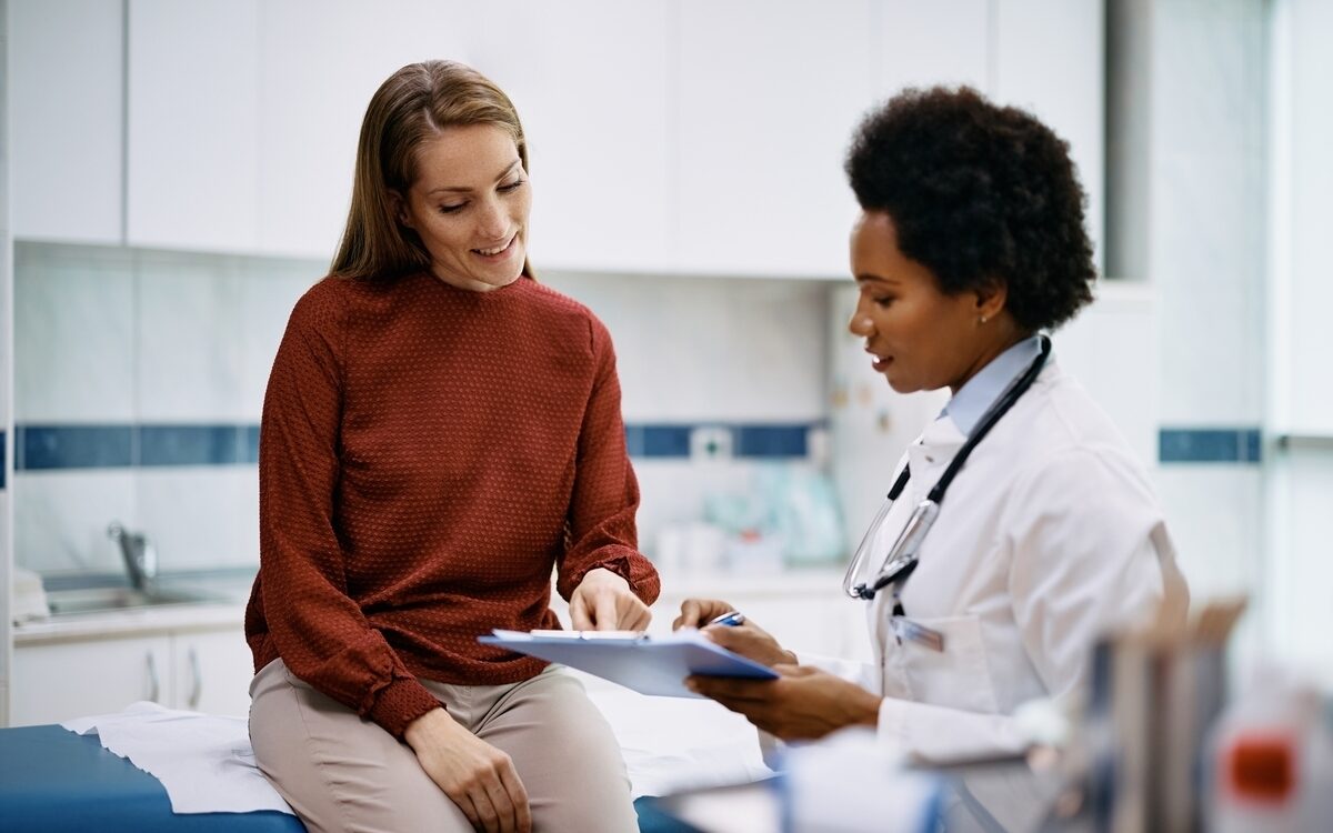 Healthcare provider reviewing lab tests for weight loss results with a patient