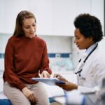Healthcare provider reviewing lab tests for weight loss results with a patient