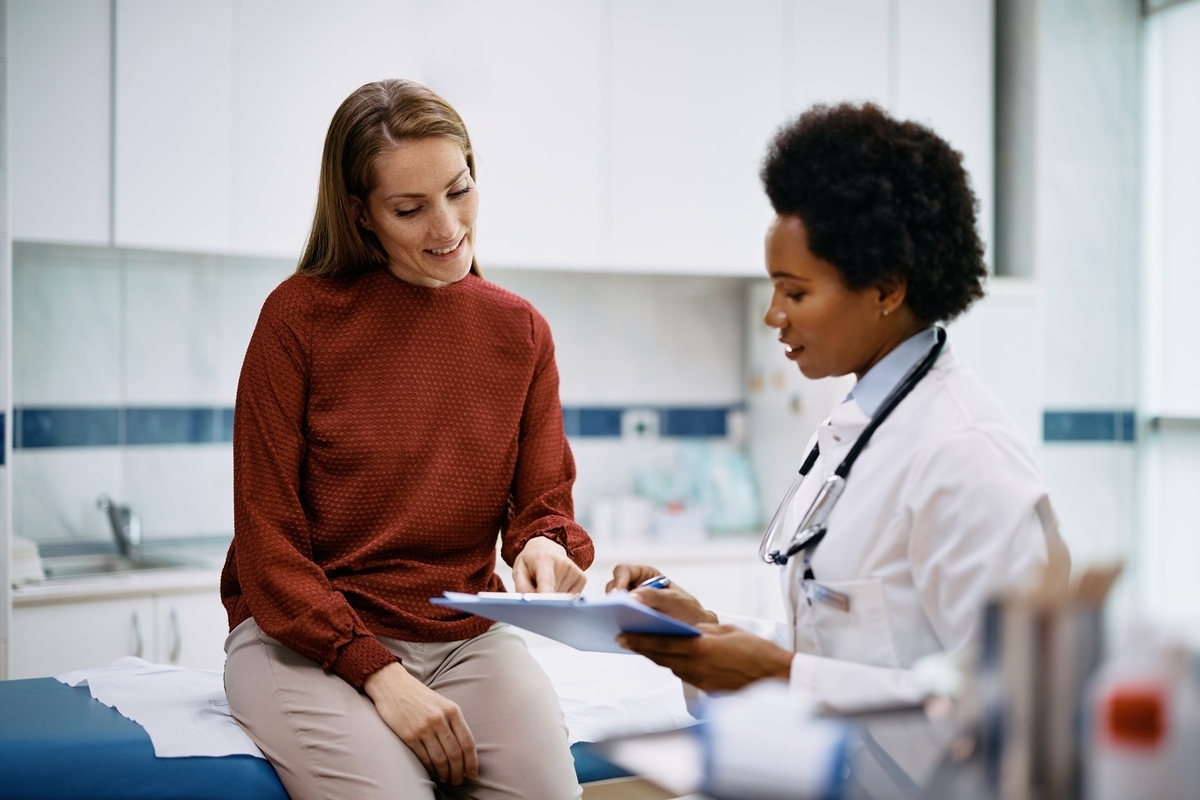 Healthcare provider reviewing lab tests for weight loss results with a patient