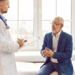 Male patient describing symptoms of fatigue to a healthcare provider during a clinical consultation about testosterone therapy and fatigue related to low energy