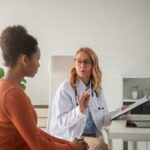 Female healthcare provider explaining how GLP-1 medications work to a patient during a medical weight loss consultation